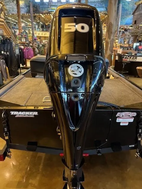 Slide: The Image of 2025 Tracker Bass Tracker Classic XL boat with powerful 50 HP engine in showroom. - 3