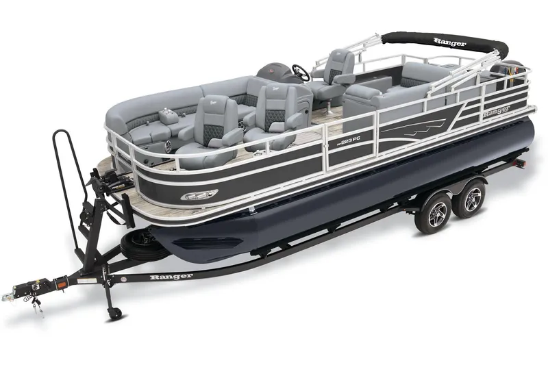 The Image of 2025 Ranger Reata 223FC pontoon boat on trailer, parked outdoors under blue sky. - 0
