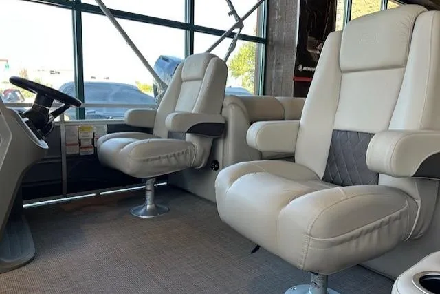 Slide: The Image of 2025 Sun Tracker Party Barge 22 DLX interior with plush seating and modern design. - 3