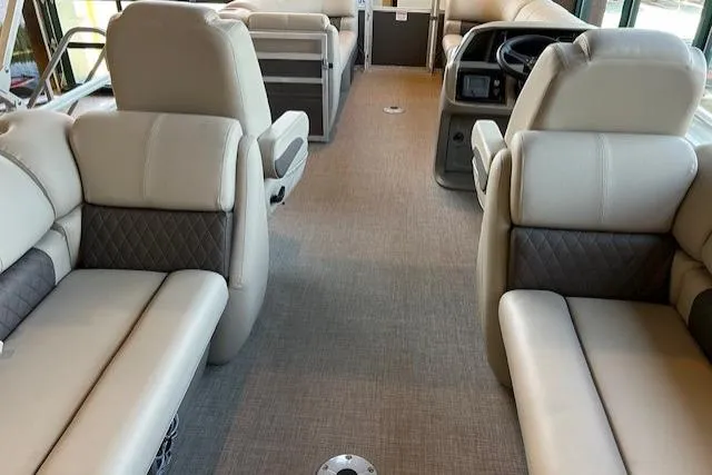 Slide: The Image of Interior of 2025 Sun Tracker Party Barge 22 DLX with plush seating and modern design. - 4