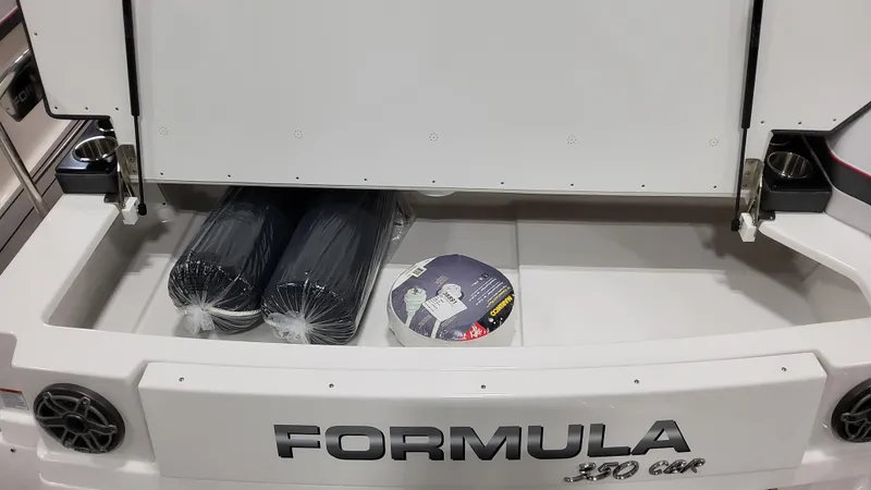 Slide: The Image of 2025 Formula 350 Crossover Bowrider I/O storage compartment with accessories. - 10