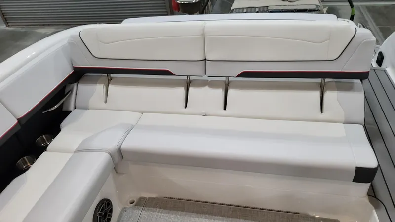 Slide: The Image of 2025 Formula 350 Crossover Bowrider I/O interior seating, featuring sleek white upholstery. - 12