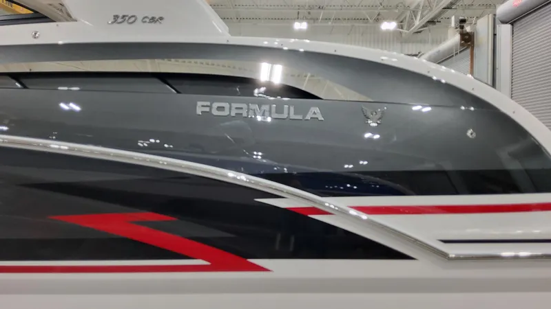 Slide: The Image of 2025 Formula 350 Crossover Bowrider I/O with sleek design and bold graphics. - 2