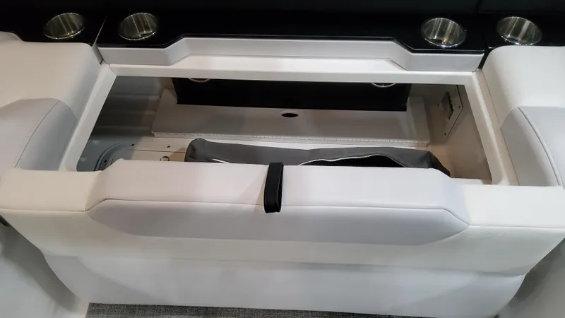 Slide: The Image of 2025 Formula 350 Crossover Bowrider I/O interior storage compartment with cup holders. - 21