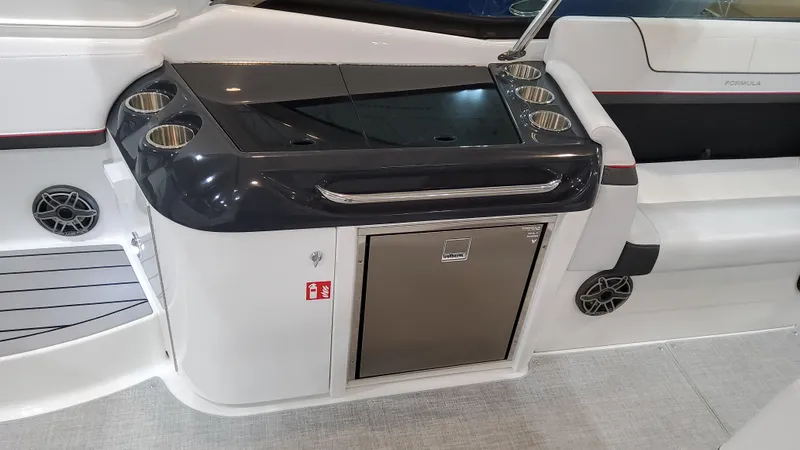 Slide: The Image of 2025 Formula 350 Crossover Bowrider I/O interior with sleek kitchenette and modern design. - 24