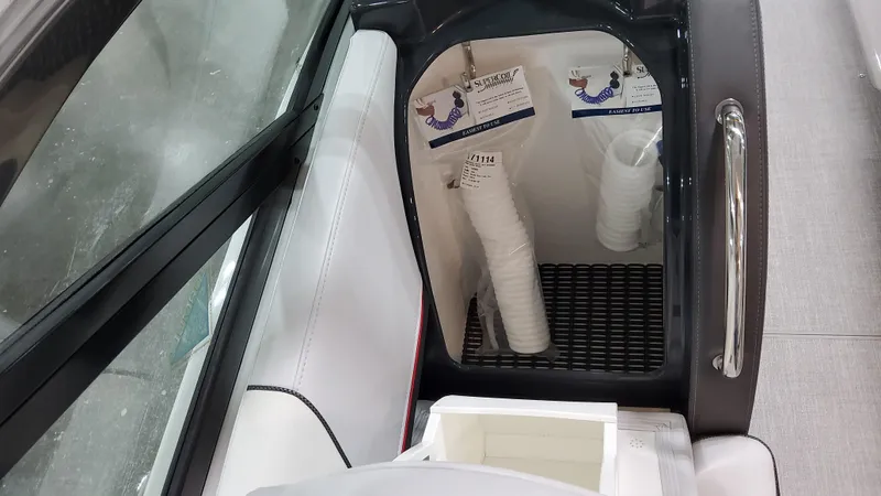 Slide: The Image of 2025 Formula 350 Crossover Bowrider I/O interior storage with cups and accessories. - 28
