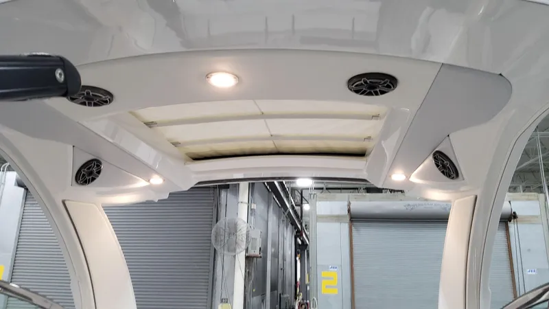 Slide: The Image of 2025 Formula 350 Crossover Bowrider I/O interior ceiling with built-in speakers and lighting. - 31