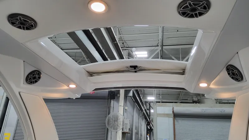 Slide: The Image of Interior view of 2025 Formula 350 Crossover Bowrider I/O with speakers and lighting. - 32