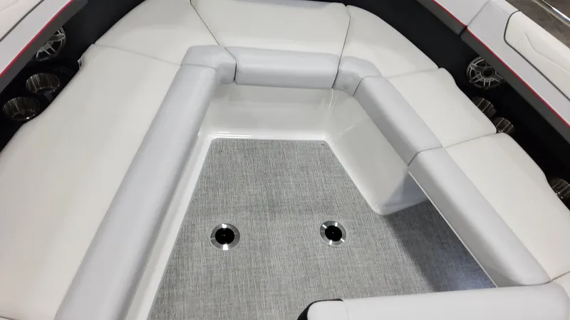 Slide: The Image of 2025 Formula 350 Crossover Bowrider I/O interior with white seating and gray flooring. - 41