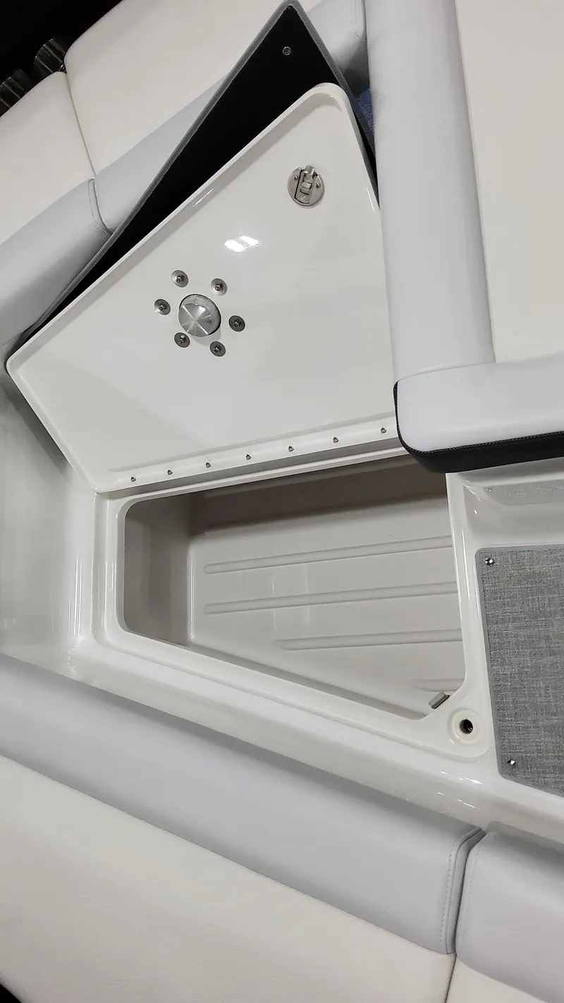 Slide: The Image of 2025 Formula 350 Crossover Bowrider I/O, open storage compartment, sleek white design. - 42