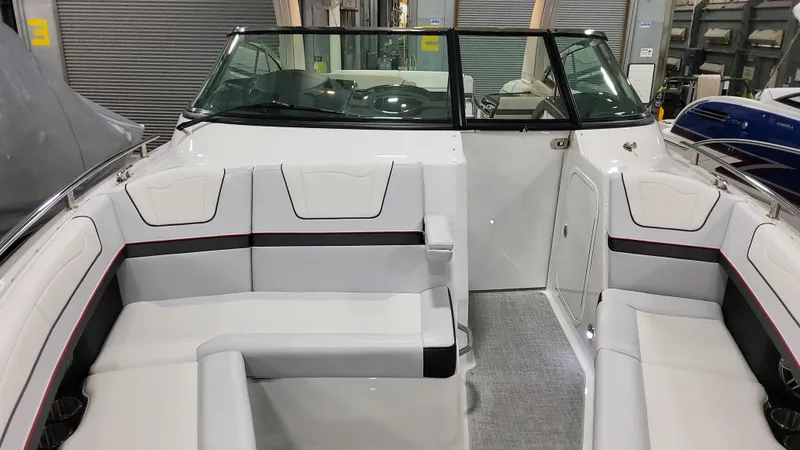 Slide: The Image of 2025 Formula 350 Crossover Bowrider I/O interior with white seating and windshield. - 45