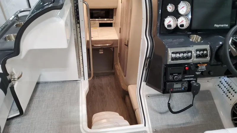 Slide: The Image of Interior view of 2025 Formula 350 Crossover Bowrider I/O, featuring cockpit and cabin entrance. - 46