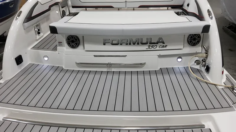 Slide: The Image of 2025 Formula 350 Crossover Bowrider I/O, sleek design, spacious deck, luxury features. - 8