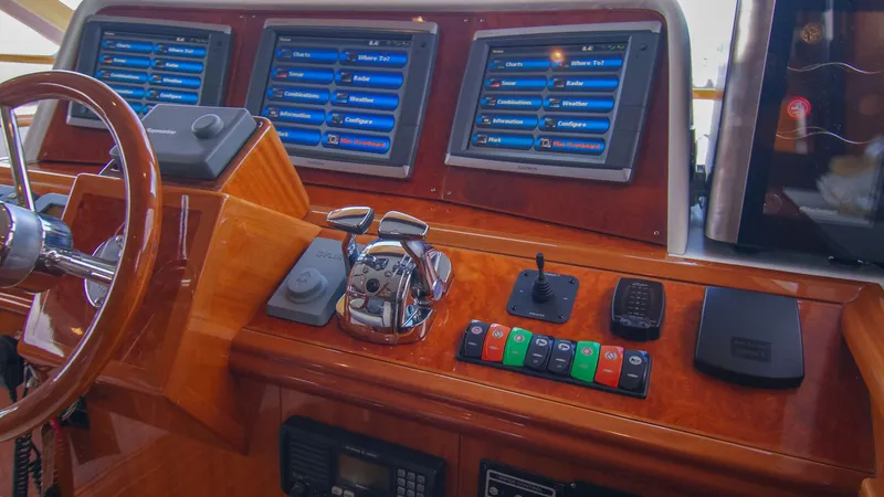 Slide: The Image of Control panel of a 2008 McKinna Pilothouse yacht with advanced navigation displays. - 17