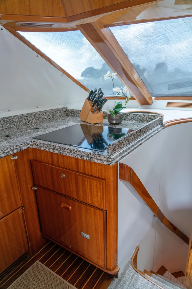 Slide: The Image of 2008 McKinna Pilothouse interior with granite countertop and wooden cabinetry. - 22