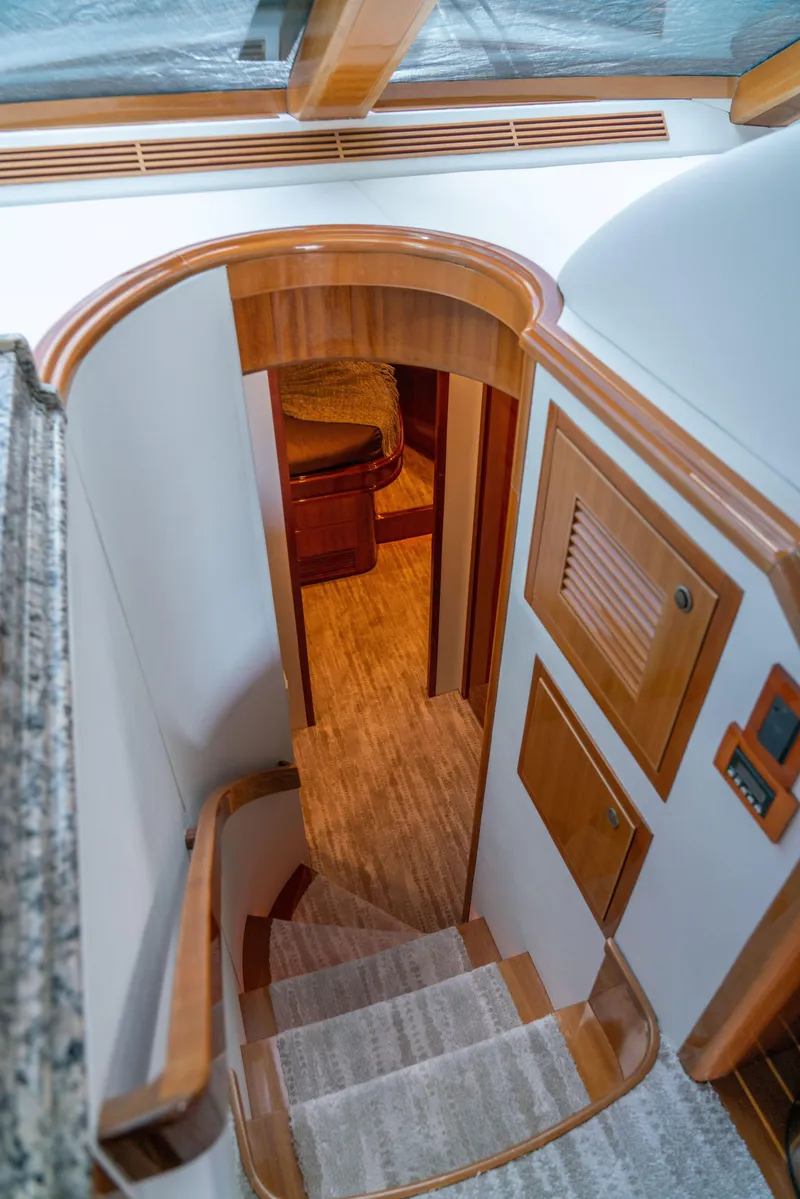 Slide: The Image of Interior staircase of 2008 McKinna Pilothouse yacht with wooden accents. - 23