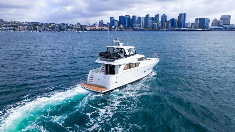 Slide: The Image of 2008 McKinna Pilothouse yacht cruising near city skyline on a cloudy day. - 44