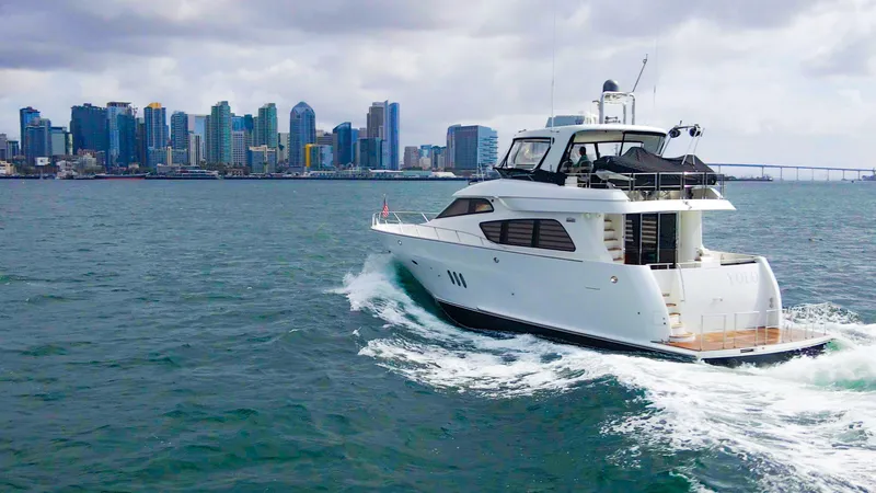 Slide: The Image of 2008 McKinna Pilothouse yacht cruising near city skyline on a cloudy day. - 47