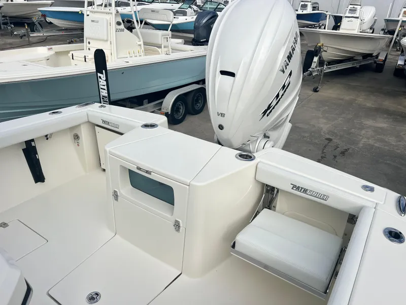Slide: The Image of 2025 Pathfinder 2700 Open boat with Yamaha V8 engine, docked in a marina. - 11