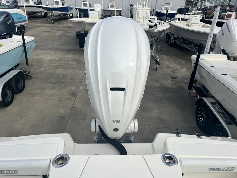 Slide: The Image of 2025 Pathfinder 2700 Open boat with powerful outboard engine in a marina. - 15