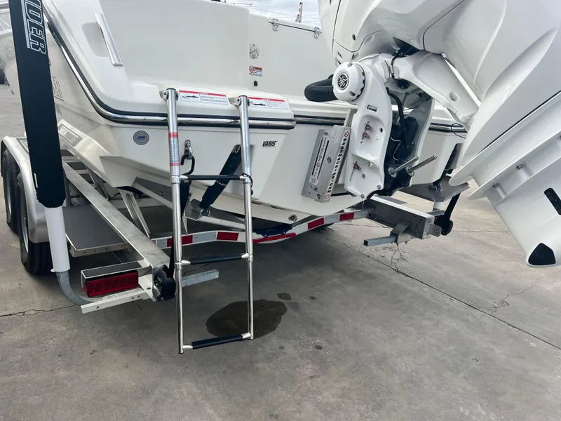 Slide: The Image of 2025 Pathfinder 2700 Open boat rear view with ladder and motor on trailer. - 16