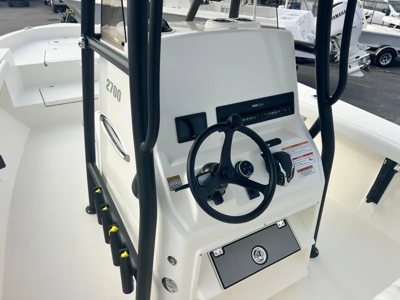 Slide: The Image of 2025 Pathfinder 2700 Open boat console with steering wheel and controls. - 7