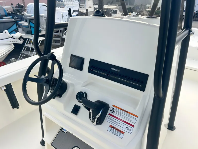 Slide: The Image of 2025 Pathfinder 2700 Open boat console with steering wheel and controls. - 8
