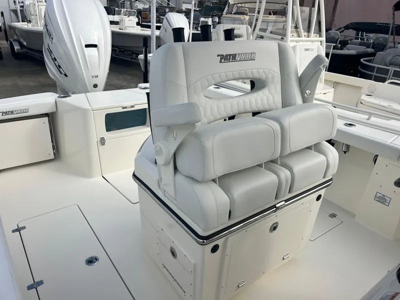 Slide: The Image of 2025 Pathfinder 2700 Open boat interior with cushioned seating and storage. - 9