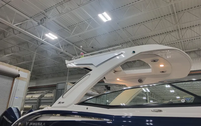 Slide: The Image of 2025 Formula 310 Bowrider OB in a showroom, showcasing sleek design and modern features. - 13