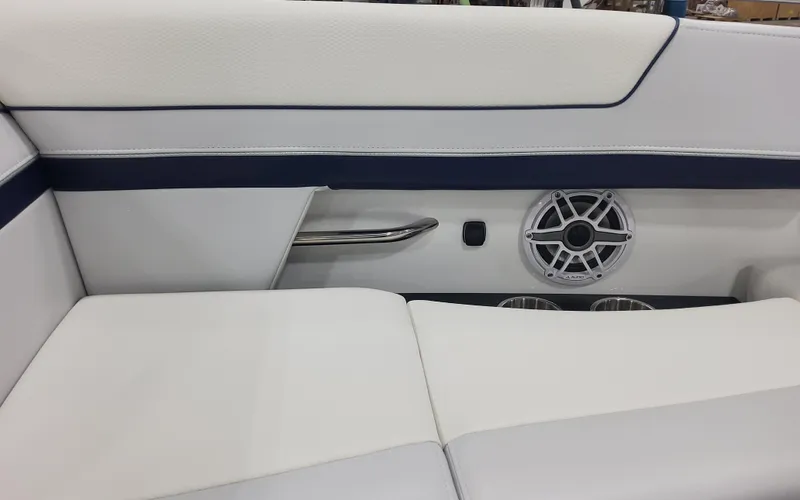 Slide: The Image of 2025 Formula 310 Bowrider OB interior with white seating and speaker detail. - 17