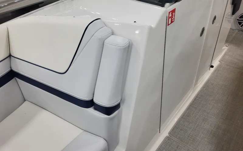 Slide: The Image of 2025 Formula 310 Bowrider OB interior seating with white and navy accents. - 24