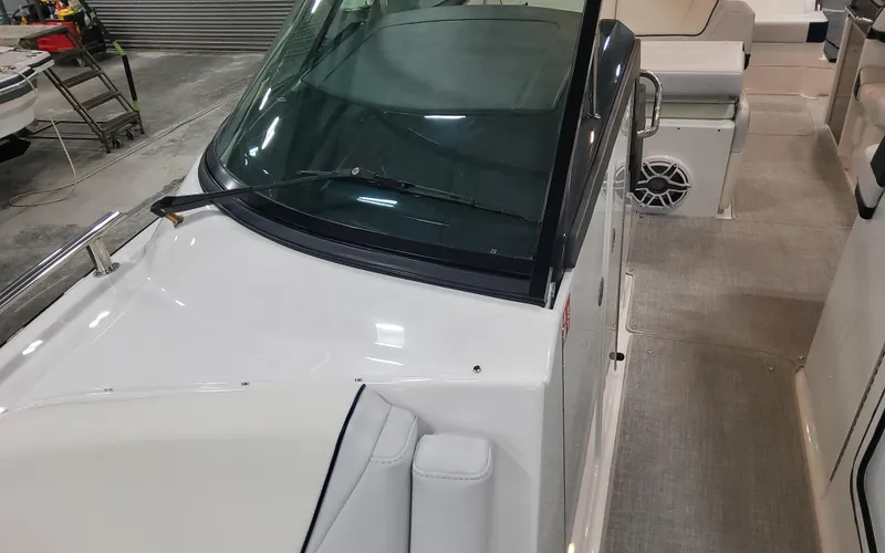 Slide: The Image of 2025 Formula 310 Bowrider OB boat interior with seating and windshield. - 25