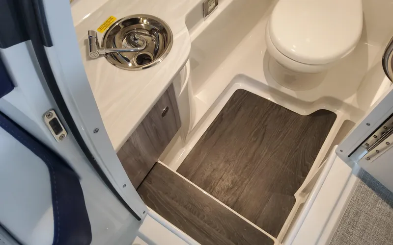 Slide: The Image of 2025 Formula 310 Bowrider OB interior bathroom with sink and toilet. - 27
