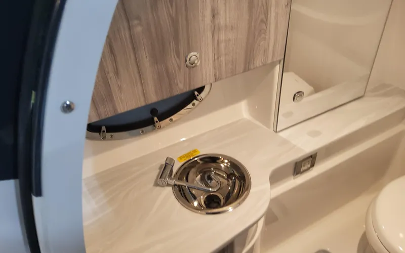 Slide: The Image of 2025 Formula 310 Bowrider OB interior with sink and wooden cabinetry. - 29