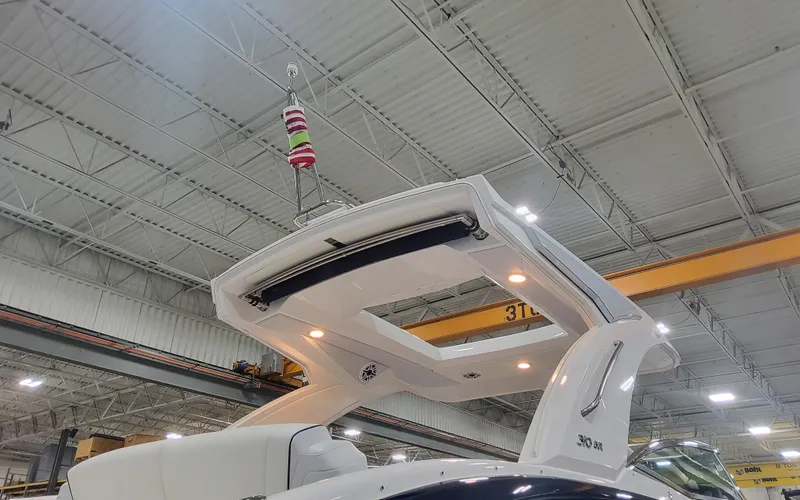 Slide: The Image of 2025 Formula 310 Bowrider OB in a warehouse, showcasing its sleek design and structure. - 3