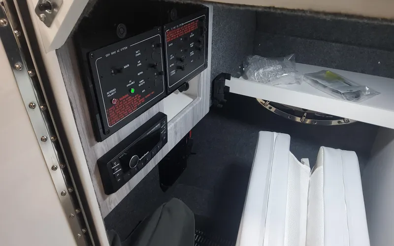 Slide: The Image of 2025 Formula 310 Bowrider OB interior cabin with control panels and seating. - 33