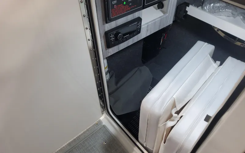 Slide: The Image of Interior view of 2025 Formula 310 Bowrider OB boat cabin with seating and controls. - 35