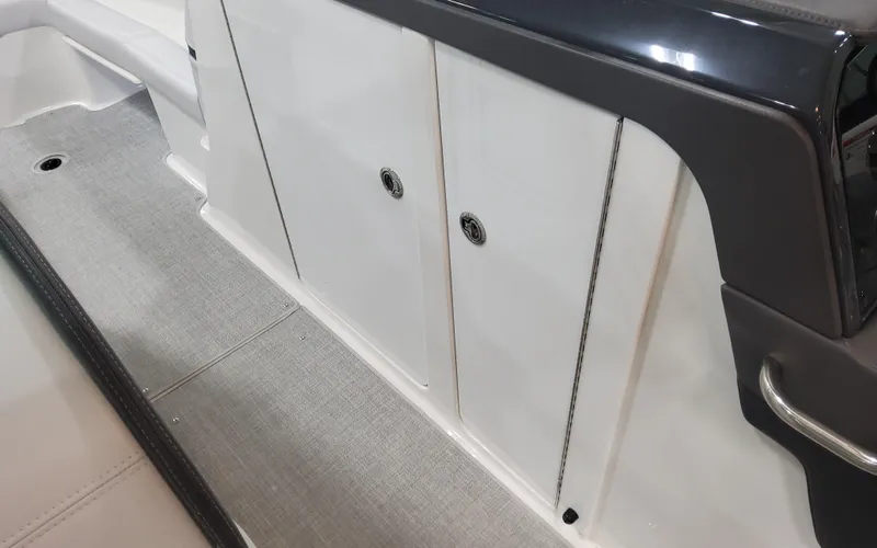 Slide: The Image of 2025 Formula 310 Bowrider OB interior storage compartment with sleek design. - 36