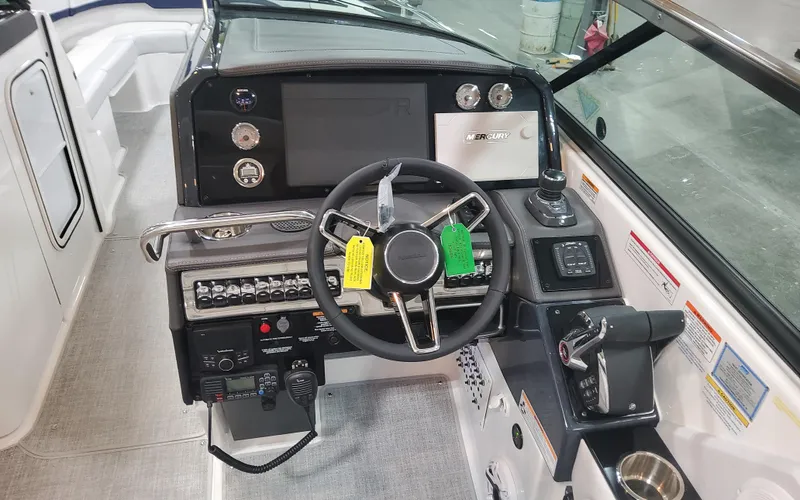 Slide: The Image of 2025 Formula 310 Bowrider OB dashboard with steering wheel and control panel. - 41