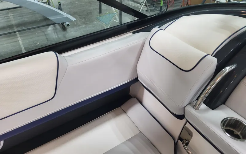 Slide: The Image of 2025 Formula 310 Bowrider OB interior with white and navy seating detail. - 44