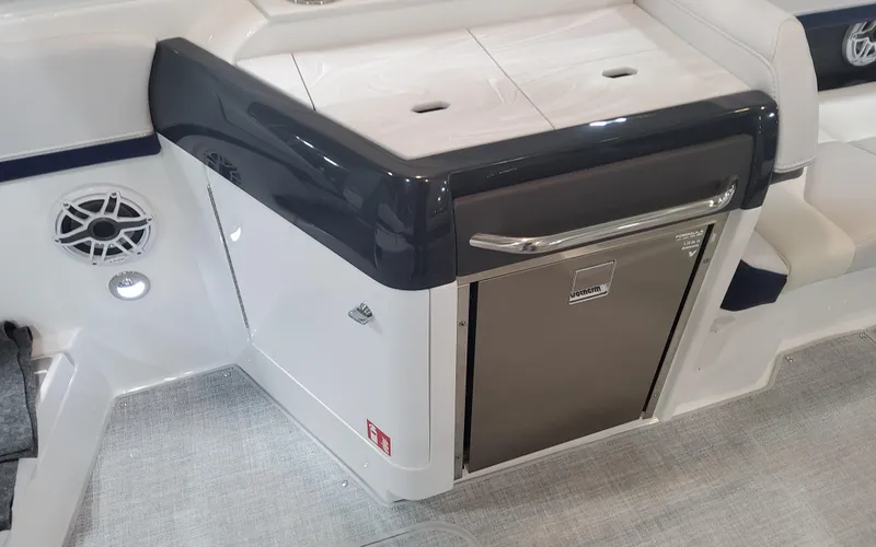 Slide: The Image of 2025 Formula 310 Bowrider OB interior with sleek cabinetry and built-in speaker. - 49