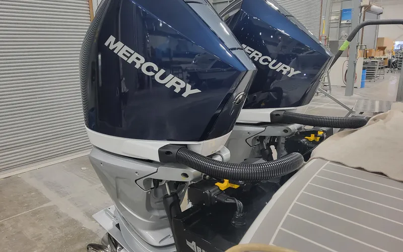 Slide: The Image of Twin Mercury outboard engines on a 2025 Formula 310 Bowrider OB boat. - 7