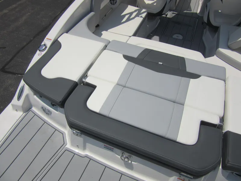 Slide: The Image of 2025 Chaparral 23 SSi boat interior with gray and white seating. - 15
