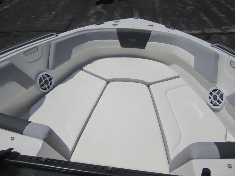 Slide: The Image of 2025 Chaparral 23 SSi boat interior with white seating and built-in speakers. - 21