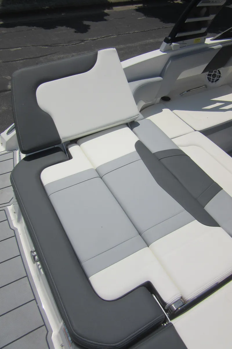 Slide: The Image of 2025 Chaparral 23 SSi boat interior with gray and white seating. - 24