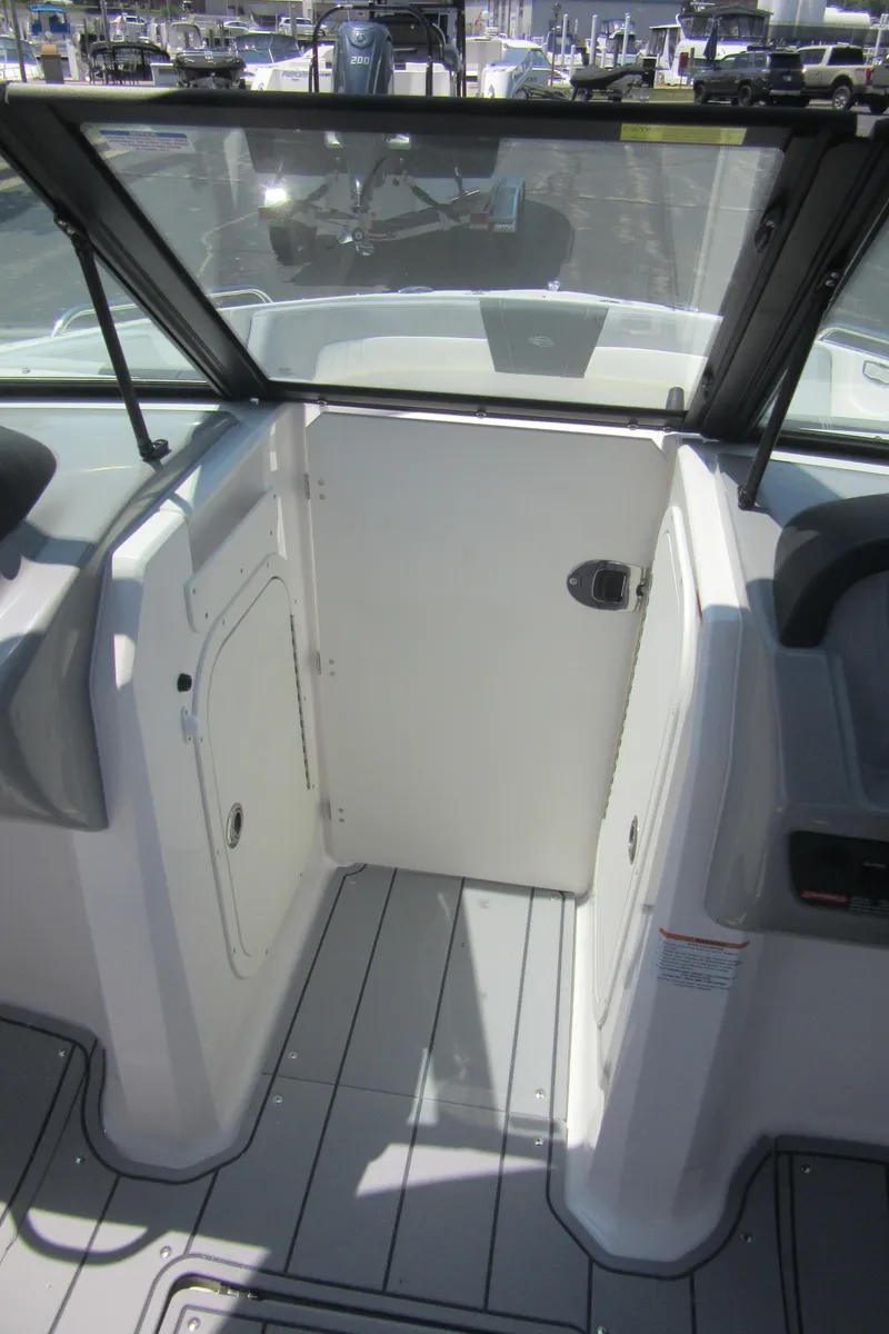 Slide: The Image of 2025 Chaparral 23 SSi boat interior with sleek design and modern features. - 28