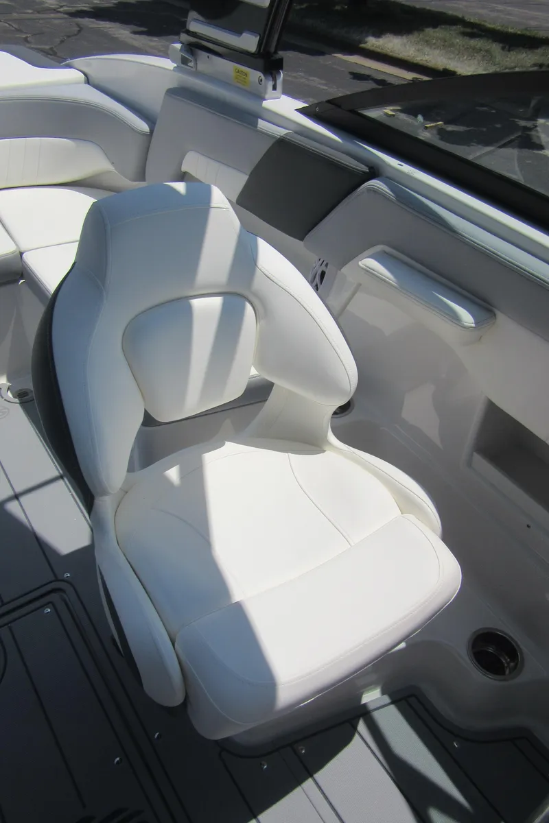 Slide: The Image of 2025 Chaparral 23 SSi boat interior with white seating and modern design. - 29