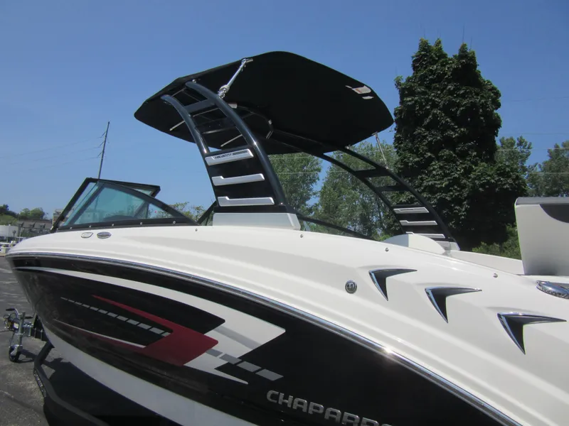 Slide: The Image of 2025 Chaparral 23 SSi boat with sleek design and modern features, under clear blue sky. - 3