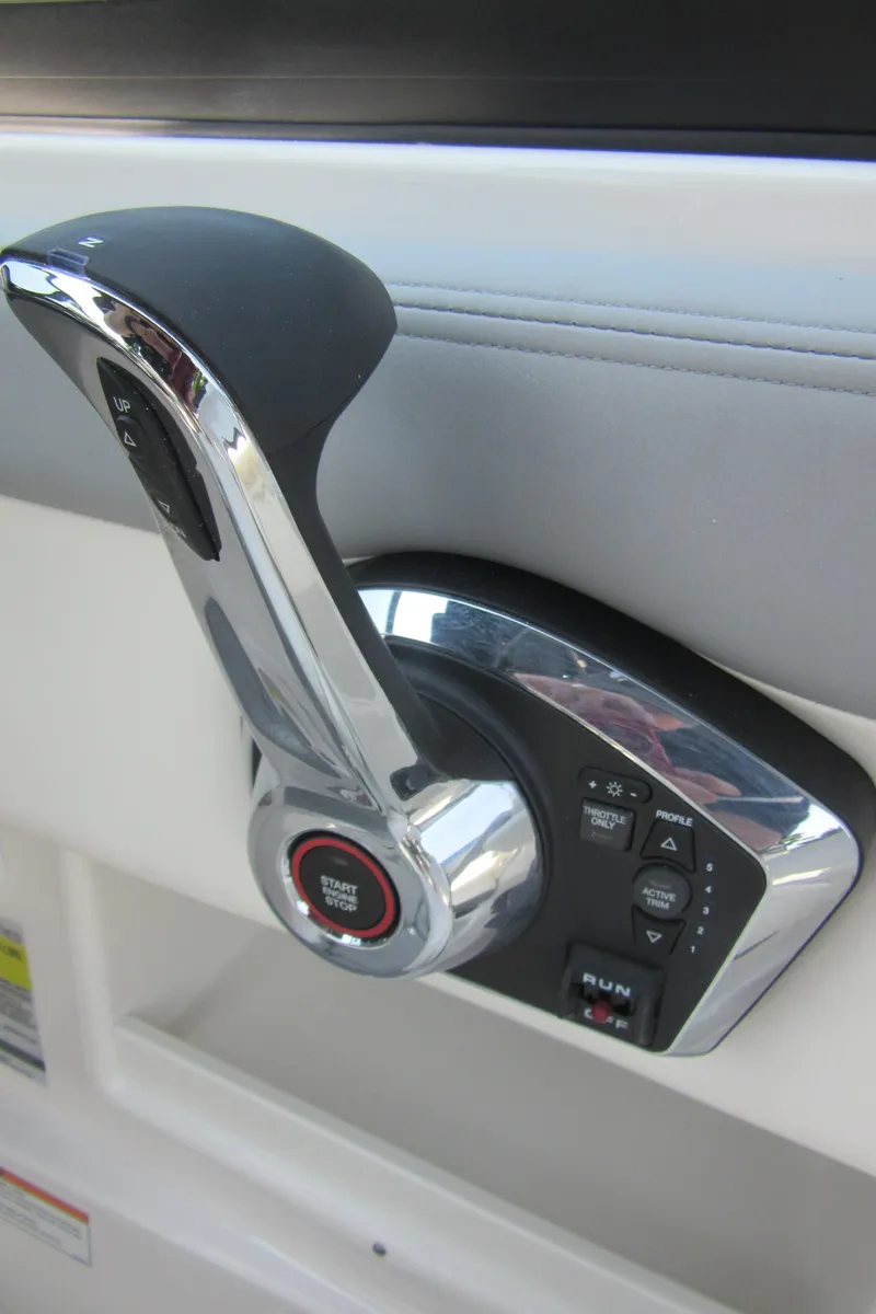 Slide: The Image of Throttle control of 2025 Chaparral 23 SSi boat, featuring sleek design and modern controls. - 30