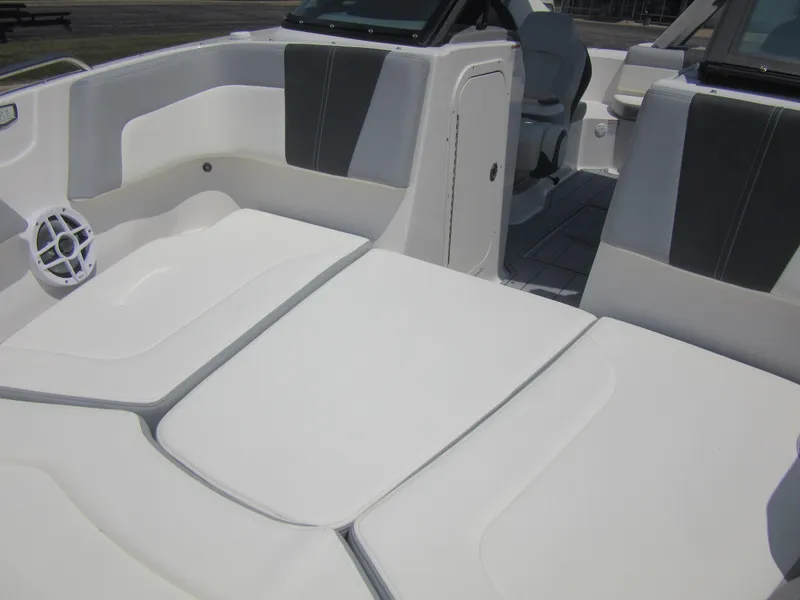 Slide: The Image of 2025 Chaparral 23 SSi boat interior with white and gray seating. - 7